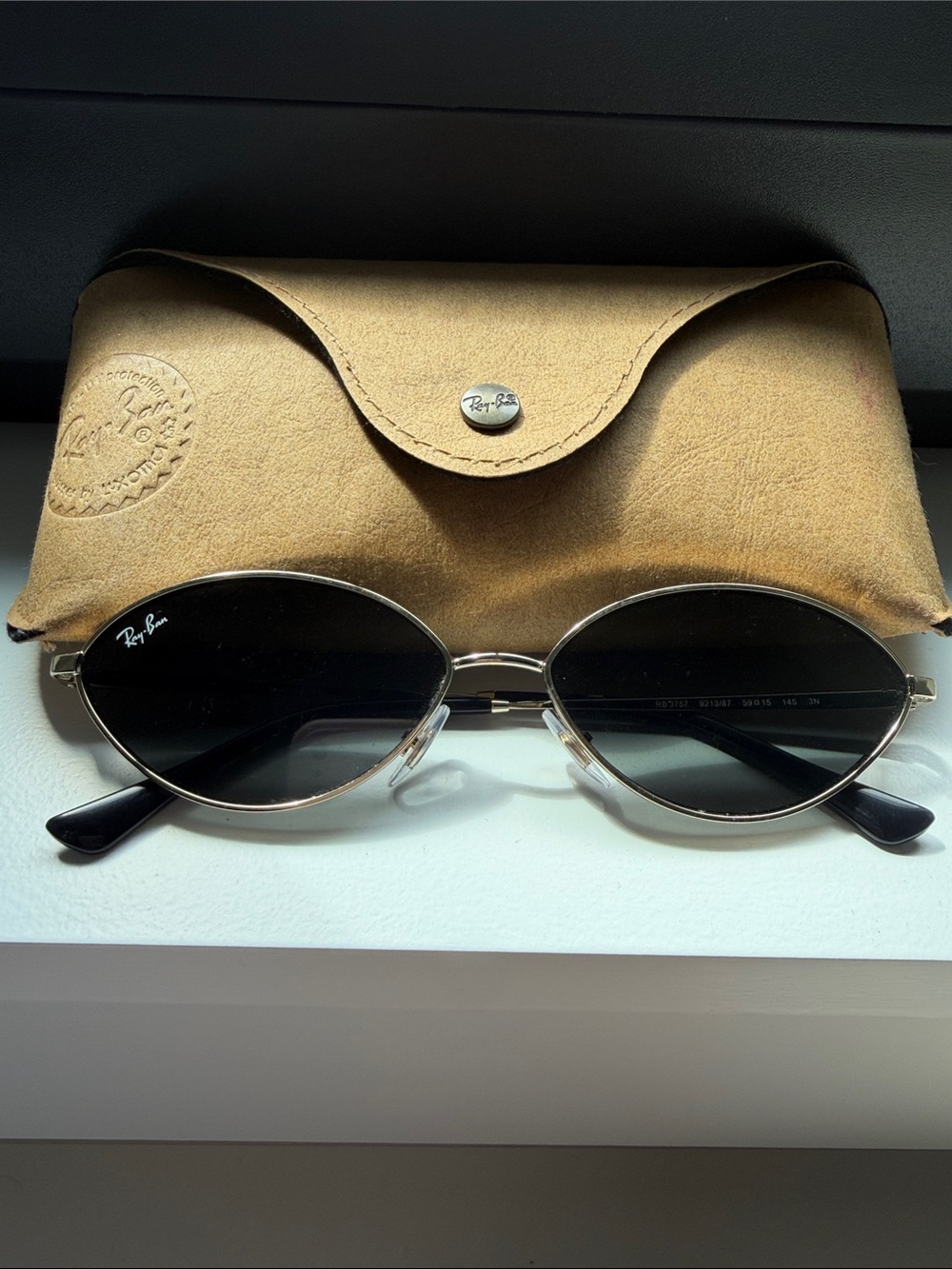 Ray-Ban Oval Metal Sunglasses in Black and Gold Frames